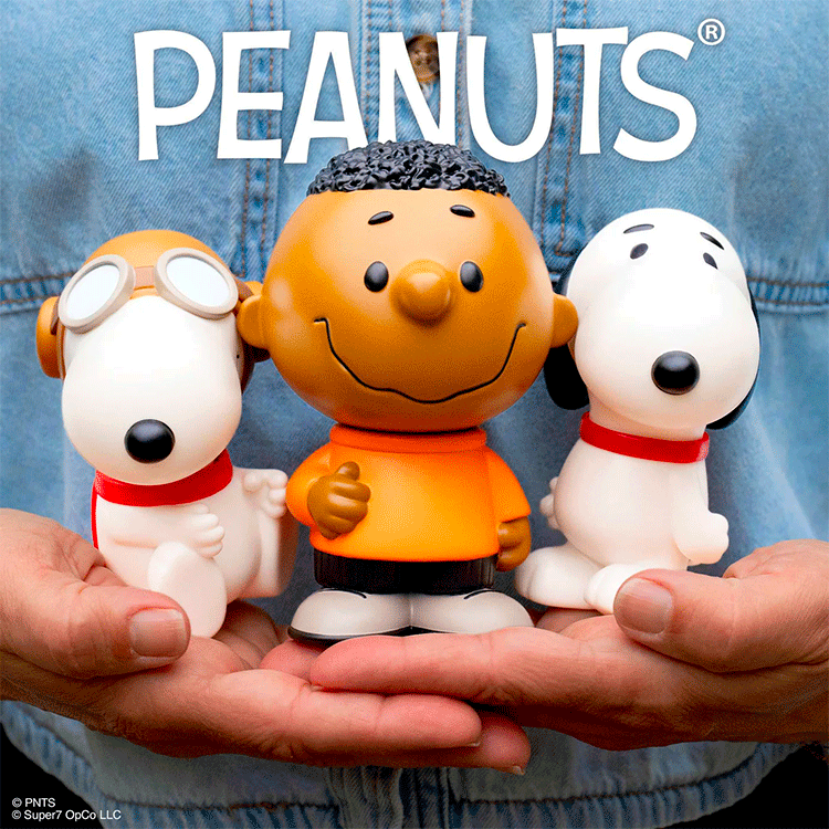 Funko Peanuts vinyl figures featuring Franklin with basketball skills and Snoopy in aviator goggles and walking pose