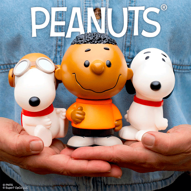 Funko Peanuts vinyl figures featuring Franklin with basketball skills and Snoopy in aviator goggles and walking pose