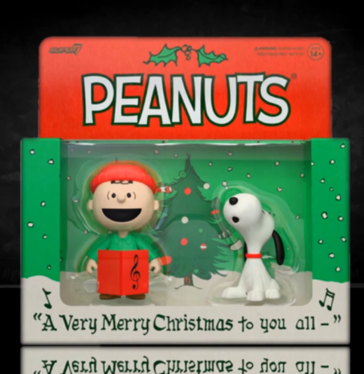 Peanuts Christmas-themed figurine set in packaging with 'Peanuts' branding.