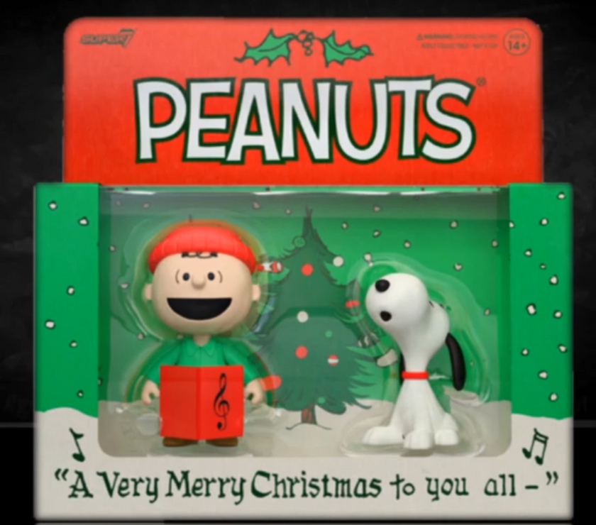 Peanuts Christmas-themed figurine set in packaging with 'Peanuts' branding.