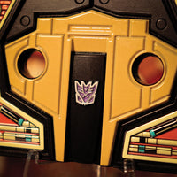 Close-up of Hasbro Transformers - Limited Edition Metal Replica - Soundwave Cassette Tape with Decepticon emblem detail