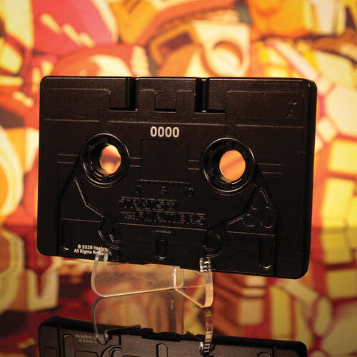 Transformers - Limited Edition Metal Replica - Soundwave Cassette Tape by Hasbro on display stand against colorful background