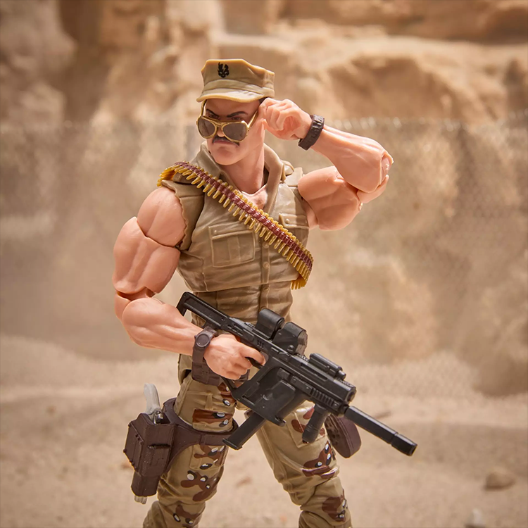 Hasbro GI Joe Sgt Slaughter action figure in desert camo with sunglasses and detailed weapon accessories