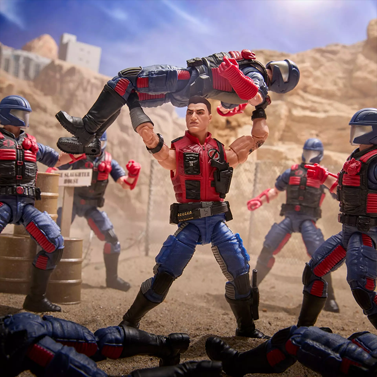 Hasbro GI Joe Sgt Slaughter action figure lifting enemy Mercer with detailed desert battle backdrop.