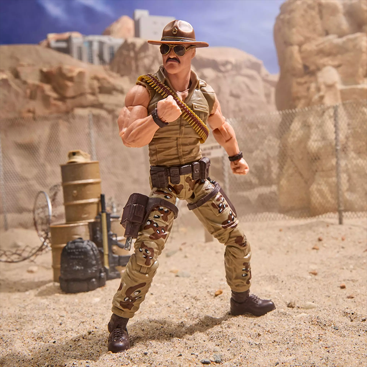 Hasbro GI Joe Classified Sgt Slaughter action figure posed in desert terrain with muscular detail and accessories