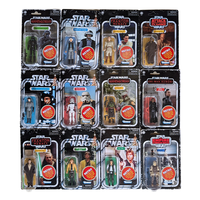 Collection of retro Star Wars action figures in original Kenner packaging, featuring various characters from the franchise.
