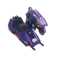 Purple futuristic vehicle with two cockpits, colorful control panels, and a seated armored figure