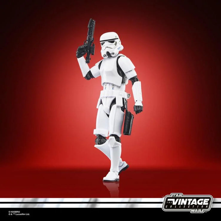 Hasbro Star Wars Vintage Collection Imperial Stormtrooper 3.75 inch action figure posed with blaster on red background