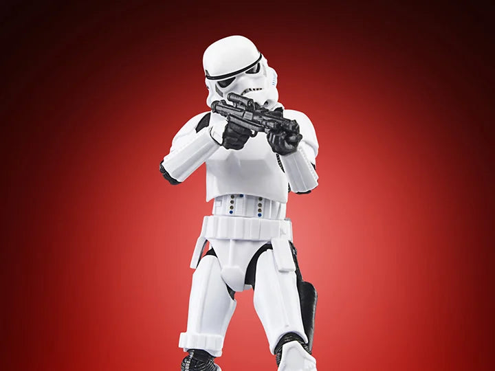 Hasbro Star Wars Vintage Collection Imperial Stormtrooper 3.75 inch action figure aiming blaster on red background
