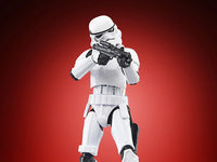 Hasbro Star Wars Vintage Collection Imperial Stormtrooper 3.75 inch action figure aiming blaster on red background