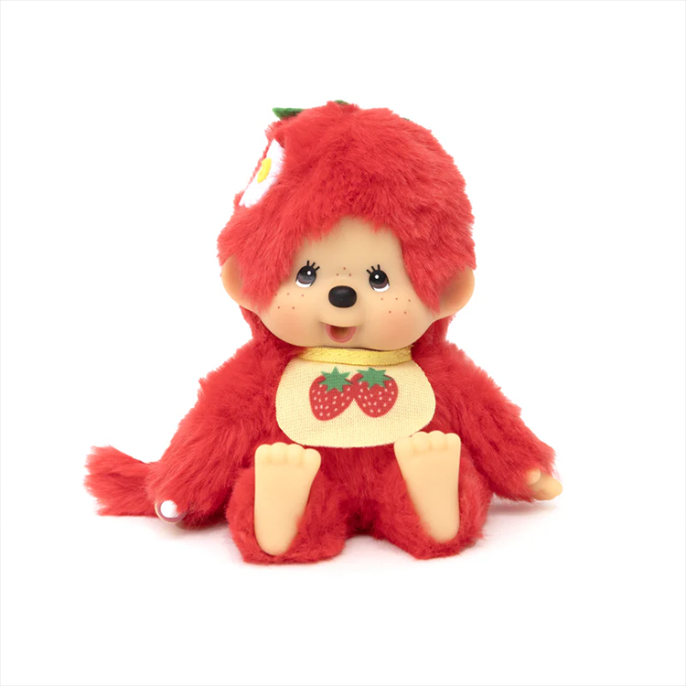 Sekiguchi Monchhichi plush in bright strawberry red with soft body and plastic head, hands, and feet sitting upright