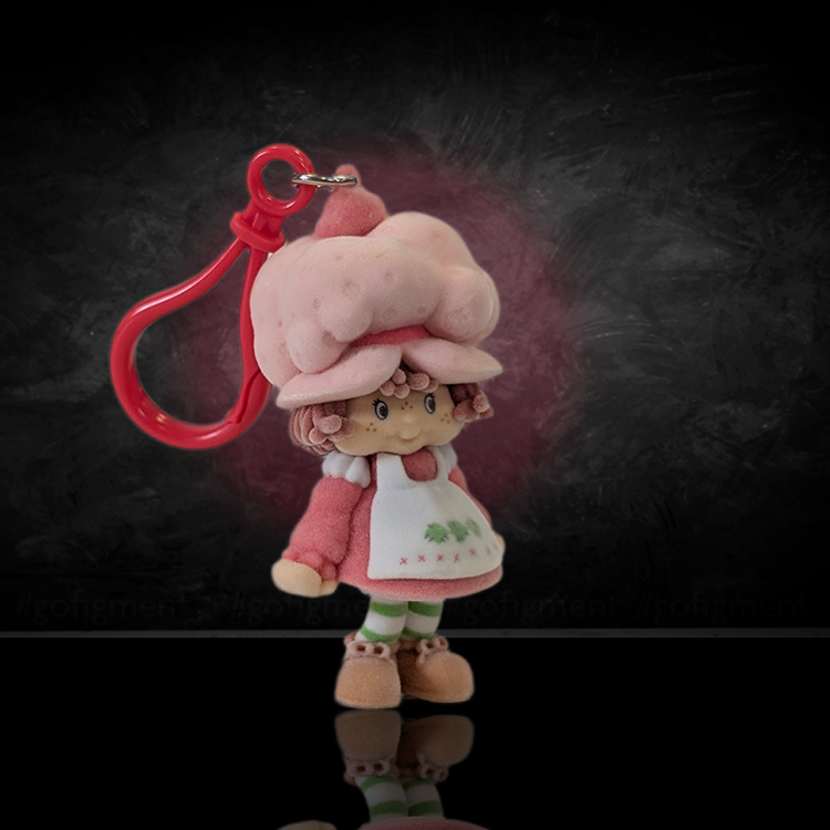 UCC World of Strawberry Shortcake soft flocked mini figure clip wearing pink hat and white apron with red plastic hook attachment