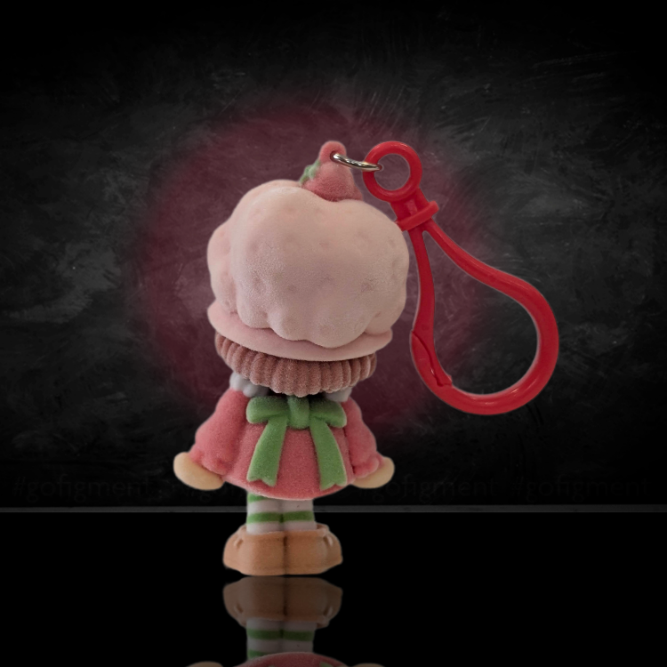 UCC World of Strawberry Shortcake flocked mini figure clip with pink outfit and red plastic hook viewed from behind