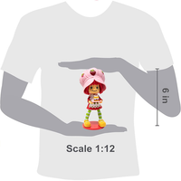 Boss Fight Studio Llc Strawberry Shortcake collectible figure with pink hat, striped leggings, yellow shoes, and cake accessory on red base