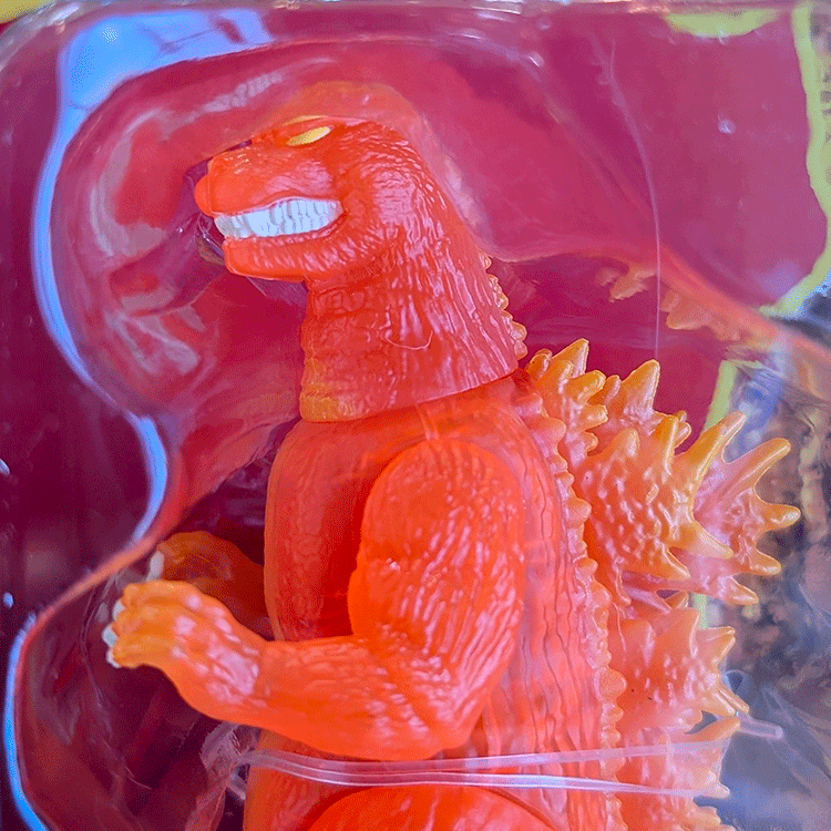 Blazing orange and yellow translucent Godzilla action figure by Super7 in 1:18 scale inside packaging