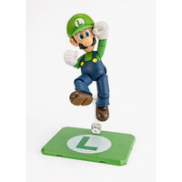 Super Mario Bros Luigi S.H.Figuarts Action Figure by Bandai Tamashii Nations posed mid-jump on display stand by SH Figuarts