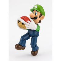 Super Mario Bros Luigi S.H.Figuarts Action Figure by Bandai Tamashii Nations holding a red shell collectible toy by SH Figuarts.