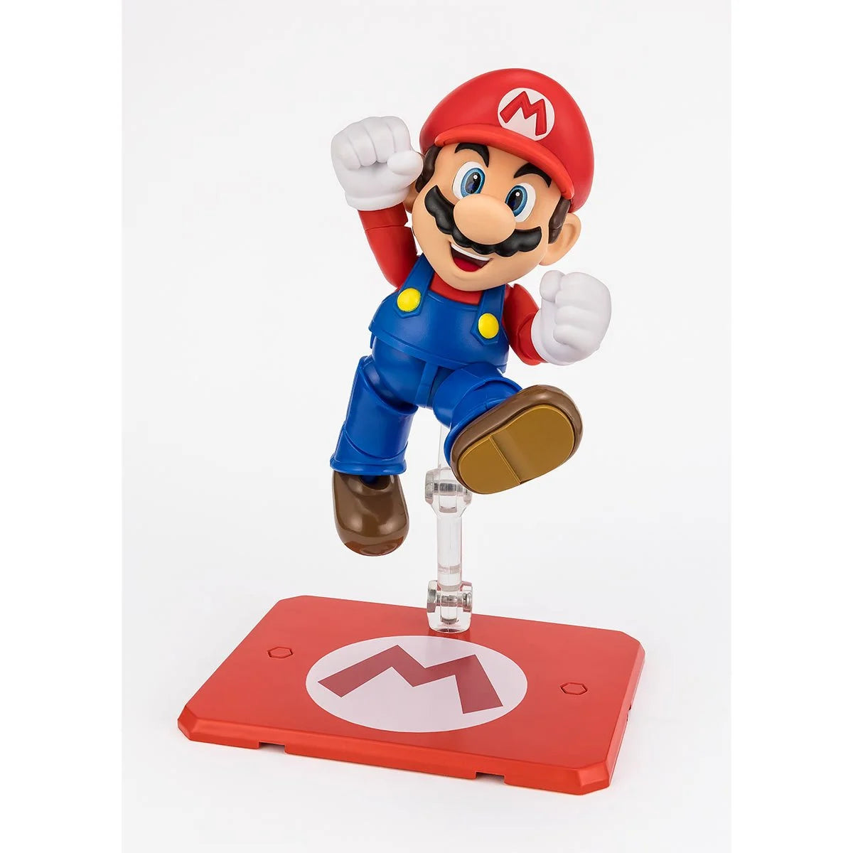 Super Mario Bros Mario S.H.Figuarts Action Figure by Bandai Tamashii Nations in dynamic jumping pose with stand by SH Figuarts