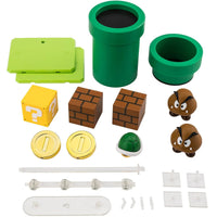 SuSuper Mario Bros S.H.Figuarts Action Figure Playset by Bandai Tamashii Nations includes pipes, blocks, coins, Goombas, and accessories by SH Figuarts.