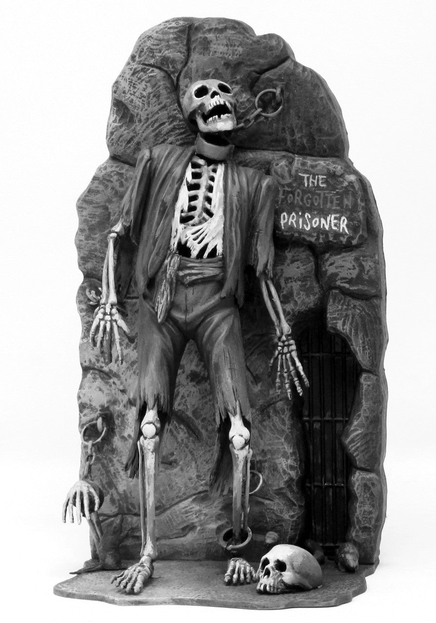 Atlantis Models Forgotten Prisoner of Castel-Mare Glow in the Dark Edition skeleton figure chained to dungeon wall with skulls and gate