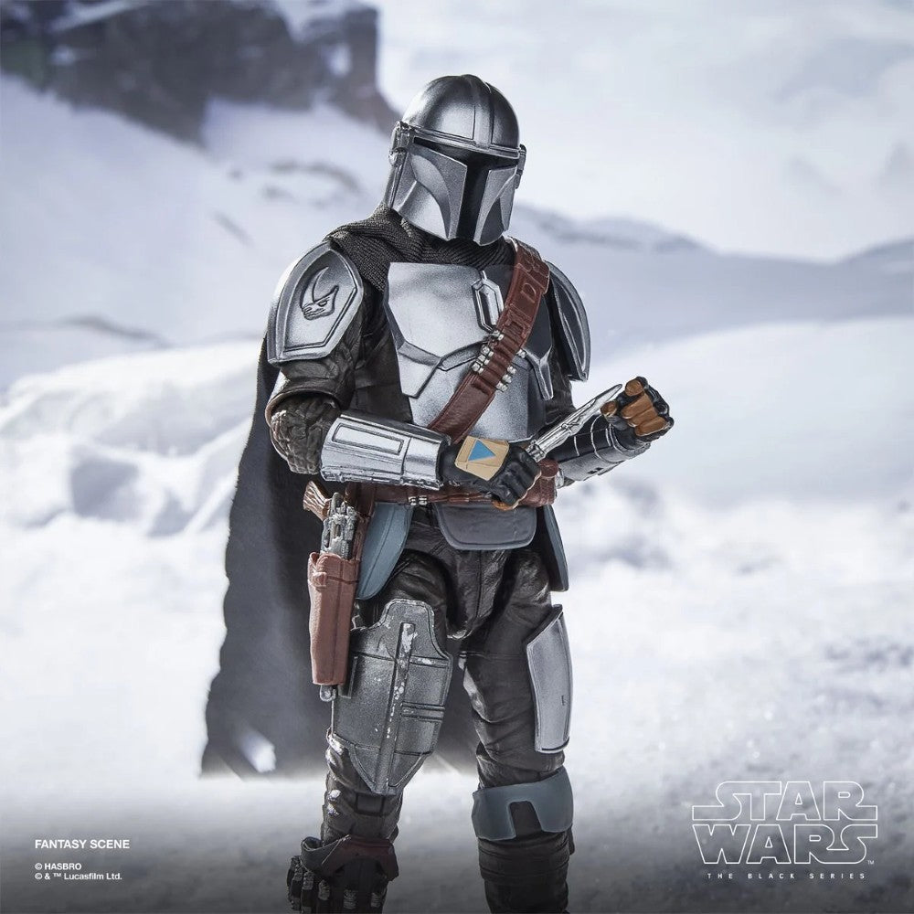 The Mandalorian & Grogu Star Wars The Black Series Deluxe 6-Inch Action Figure Set with Accessories by Hasbro displayed in snowy scene