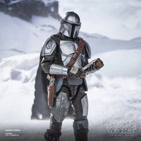 The Mandalorian & Grogu Star Wars The Black Series Deluxe 6-Inch Action Figure Set with Accessories by Hasbro displayed in snowy scene