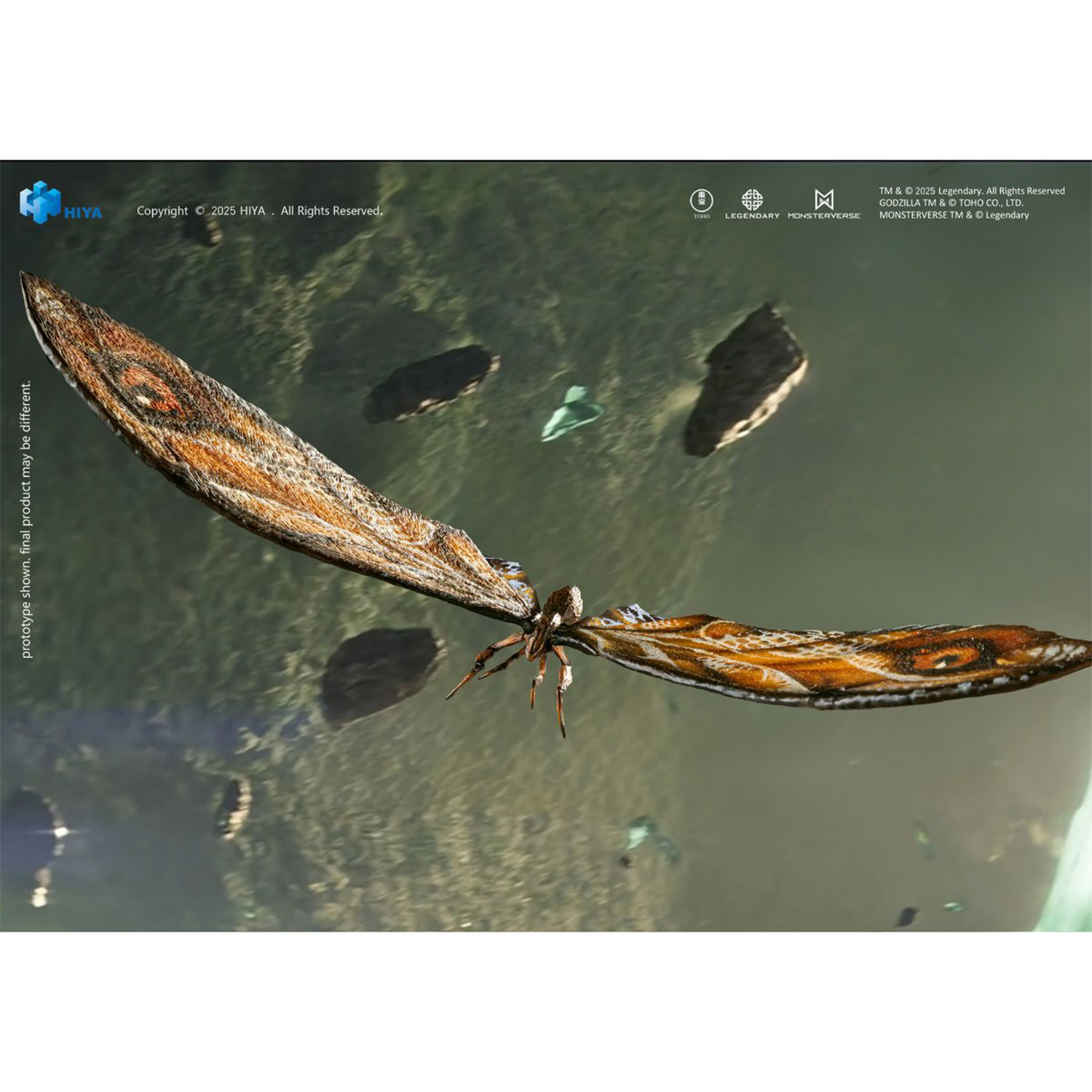Large detailed moth with textured orange and brown wings flying over rocky terrain and a misty green landscape below