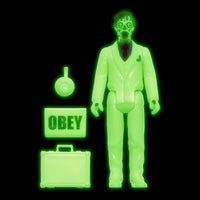 Glow-in-the-dark suited figure with skull face, OBEY sign, circular accessory, and briefcase