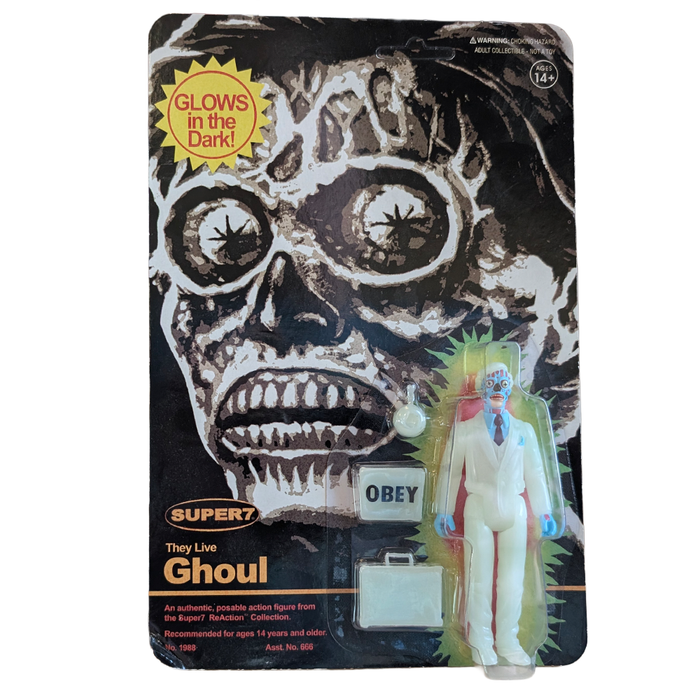 Packaged Super7 They Live Ghoul action figure with accessories and glow in the dark card art