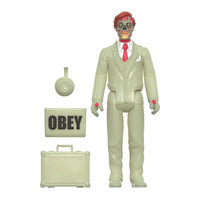 Zombie businessman figure in a pale suit with red tie, yo-yo, OBEY sign, and briefcase