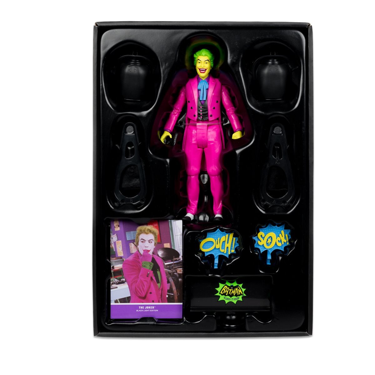 The Joker Black Light Gold Label Mcfarlane Action Figure 6" in packaging with accessories and comic-style sound effects.