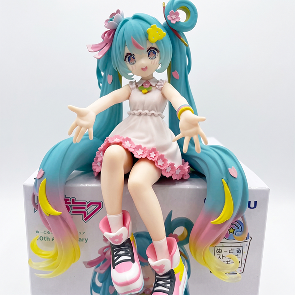 Hatsune Miku 10th Anniversary Noodle Stopper Statue FuRyu by Furyo with pastel hair and floral dress sitting pose