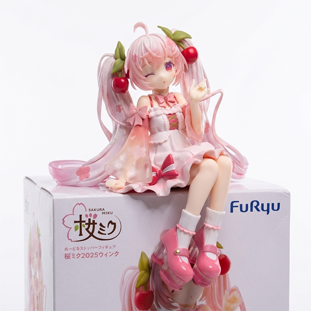 Sakura Miku Noodle Stopper Figure 2025 Wink Version Vocaloid FuRyu sitting atop branded box with pink cherry blossom details