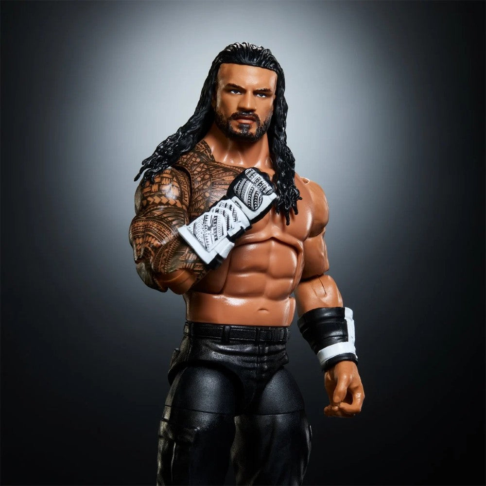 Muscular wrestler action figure with long dark hair, beard, tattoos, black pants, and white wrist wraps
