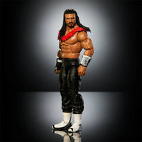 Shirtless wrestling action figure with long hair, a red lei, black pants, and white boots