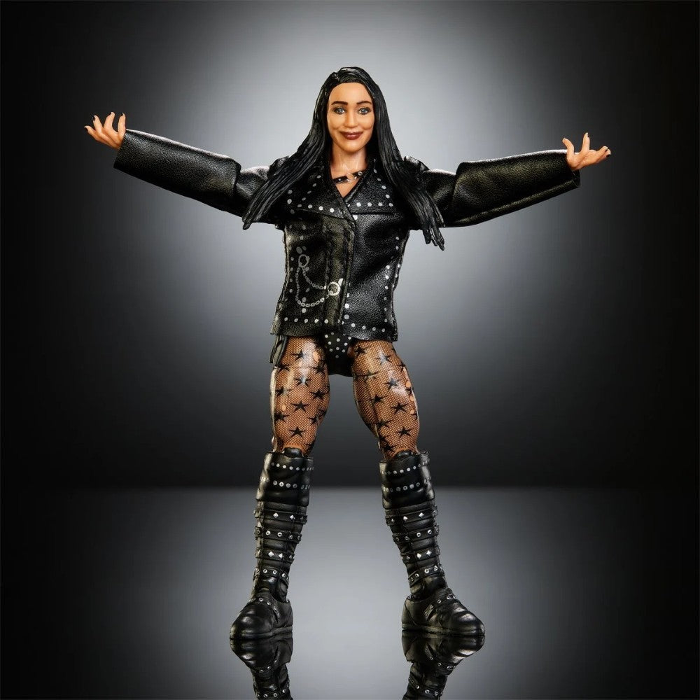 Female action figure in a black leather outfit, star-patterned tights, and knee-high boots with arms outstretched