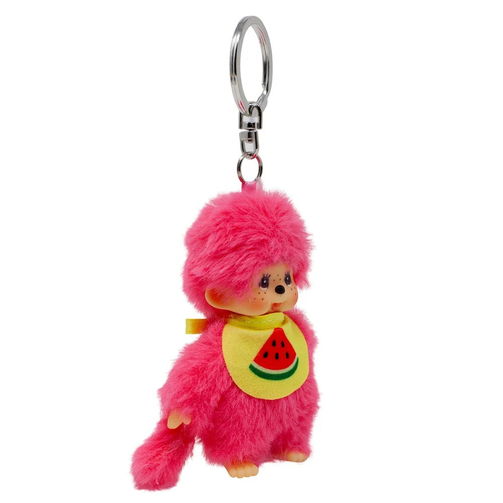 Pink Monchhichi plush keychain wearing a yellow watermelon bib