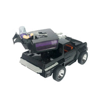 Black armored toy vehicle with mounted turret and seated action figure