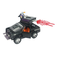 Black toy car with open doors, a mounted figure, roof cannon, and red energy effects