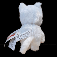 Sekiguchi Monchhichi White Cat 8-inch plush toy with tags showing care instructions back view on black background