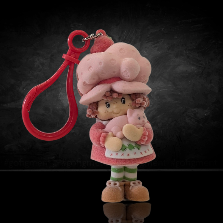 UCC World of Strawberry Shortcake flocked mini figure clip hanger holding pink pig accessory in soft-touch finish