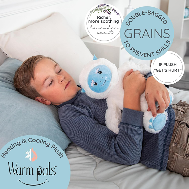 Child peacefully resting with microwavable lavender scented Yeti Plush Toy for warmth and comfort.