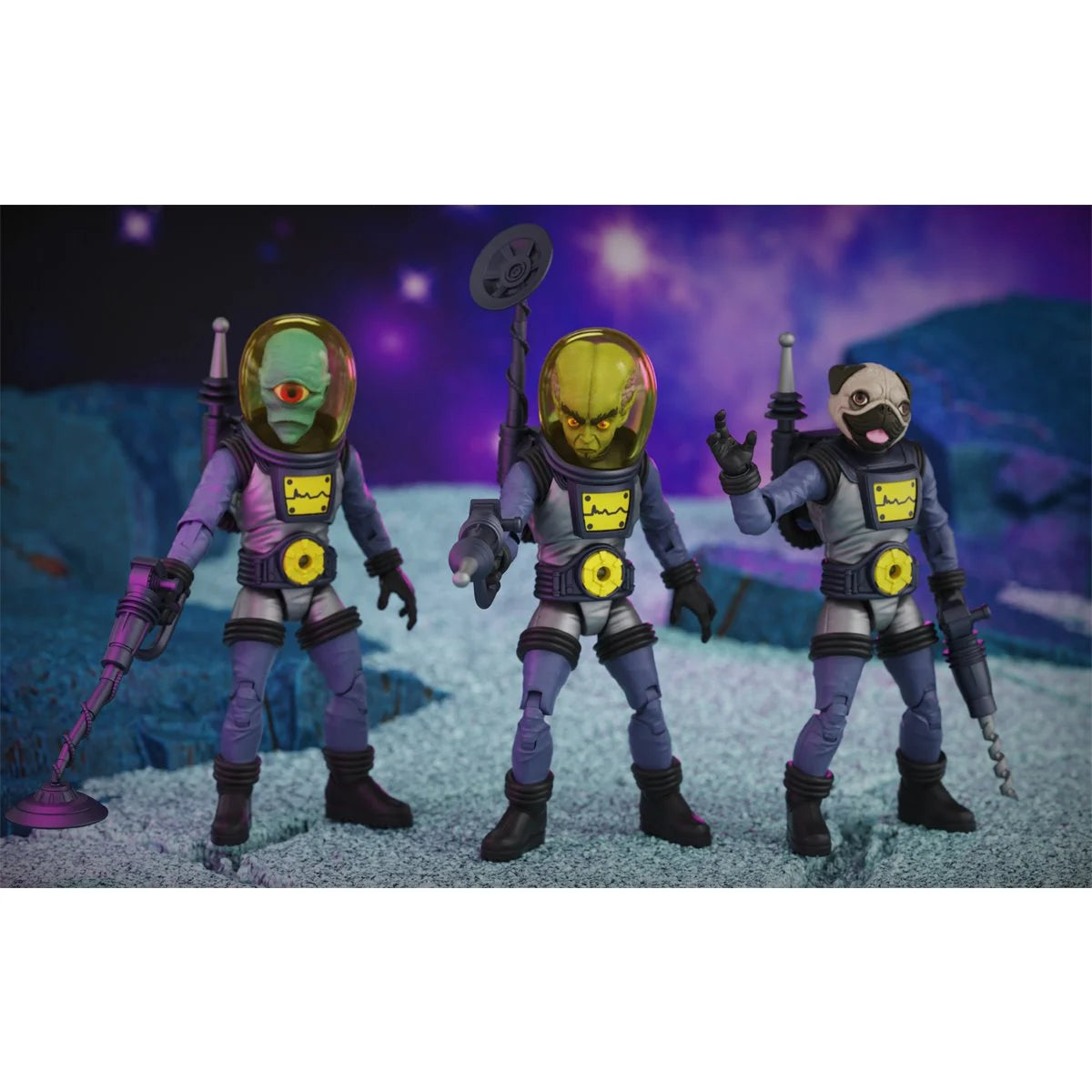 Three alien astronaut action figures in purple suits holding futuristic weapons against a colorful space backdrop