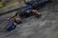 Action Figures and Collectibles by Boss Fight Studio - Vitruvian H.A.C.K.S. Action Figure: Series Z - OFFICER ZED lying on ground with blood details