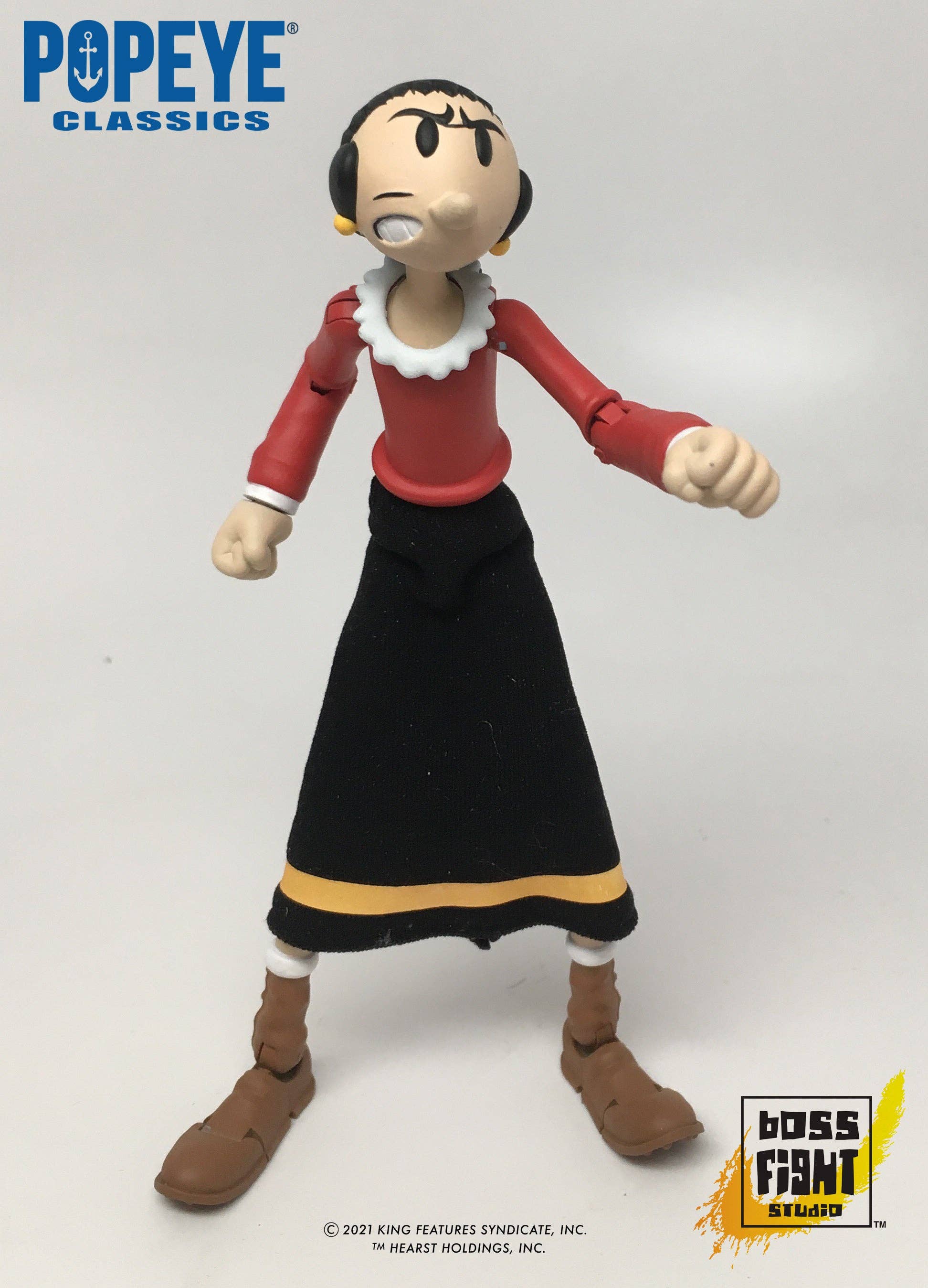 Boss Fight Studio Llc Popeye Classics Olive Oyl figure in red top and black skirt with yellow stripe standing on white background