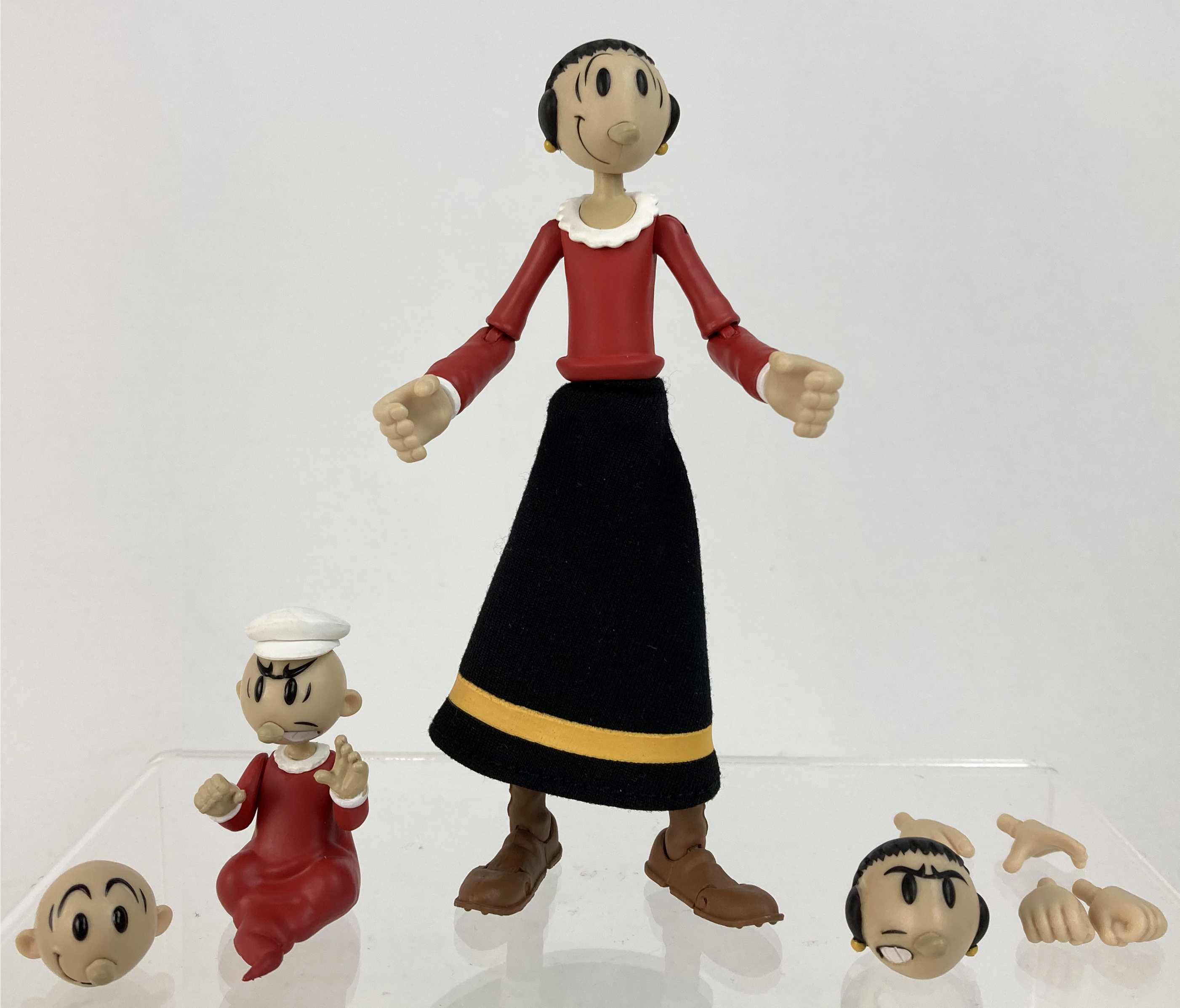 Boss Fight Studio Llc Olive Oyl figure in red shirt and black skirt with yellow stripe with Sweat Pea figure and extra faces and hands