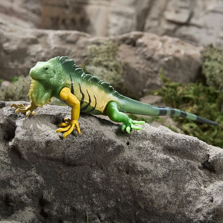 Serpentor pet iguana figure from G.I. Joe Classified Series posed on rocky surface with natural background.