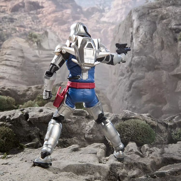 G.I. Joe Classified Series Combat Cobra Commander action figure in detailed silver combat armor aiming pistol outdoors.