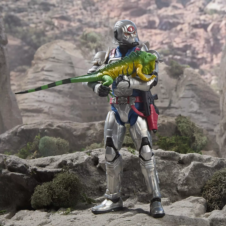 G.I. Joe Cobra Commander 6-inch action figure in combat armor holding a green serpent iguana on rocky terrain.