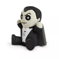 Handmade by Robots Dracula Glow in the Dark Vinyl Figure sitting with textured design and black cape